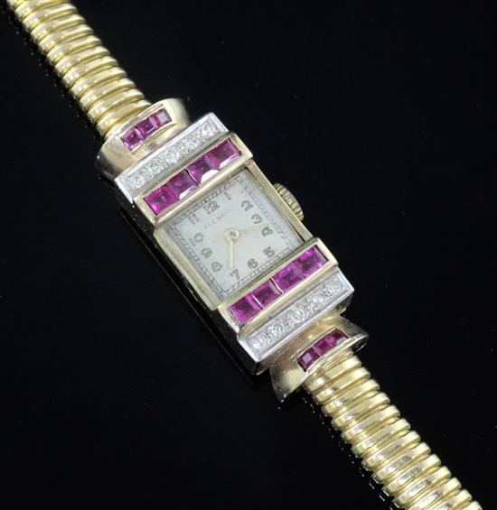 A ladys 1950s? high carat gold, synthetic? ruby and diamond set cocktail watch,